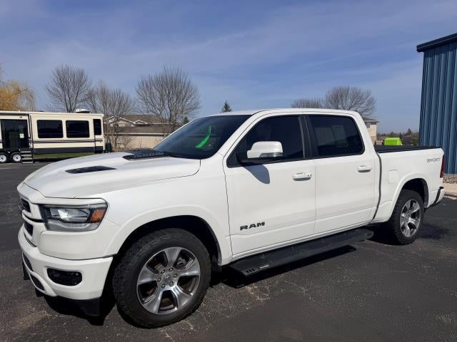 2021 RAM 1500 Laramie in White — front three-quarter view